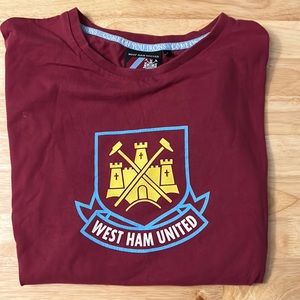 Maroon West Ham United shirt.